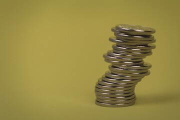 coins in stacks on a uniform background