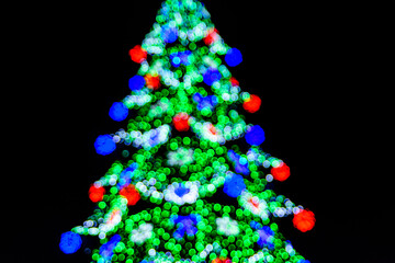 Background of the blurred colorful christmas lights. Bokeh pattern