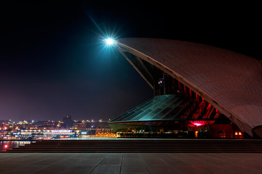 SYDNEY, AUSTRALIA - JUNE 09 2019: Colourful Lights In The Opera House, Side Profile View Across Shell And Harbour