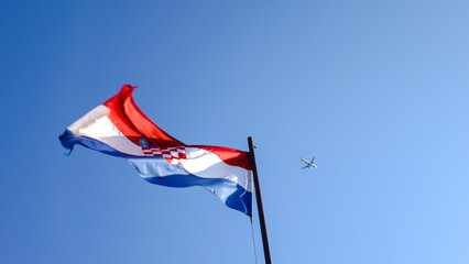 Croatian flag and an airplane shot from below