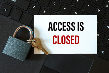 ACCESS IS CLOSED - the inscription on the card and the lock on the background of the keyboard