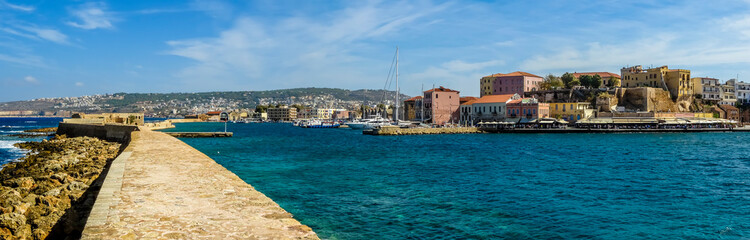 Fototapeta na wymiar A panorama view across the inner harbour in Chania, Crete on a bright sunny day