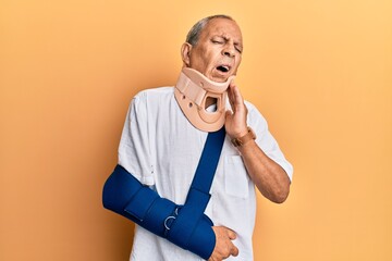 Handsome mature senior man wearing cervical collar and arm on sling touching mouth with hand with...