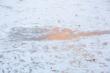 Textured winter surface of frozen water with ice and white snow