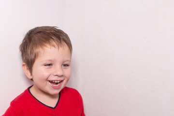 Naklejka premium Beautiful boy smiling, laughing, joy