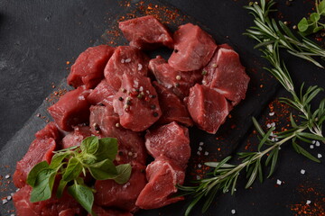Diced raw beef with ingredients, herbs and spices