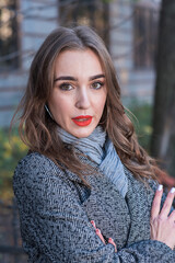 Portrait of a beautiful and happy girl outdoors. Beauty and fashion