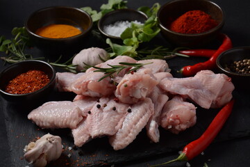 Raw chicken wings with ingredients and spices for cooking