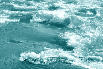 Fototapeta na wymiar Foam on water surface. Flowing water background.