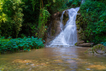 Beautiful waterfall in deep tropical forest