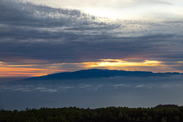 Sunset from El Teide National Park. A cloudy sunset with the sun peaking through it