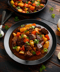 Beef Stew with carrot and baby potato in iron cast pan
