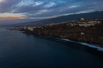 Fototapeta na wymiar Aerial view of the beautiful cliffs of Playa Castro during the evening, Tenerife