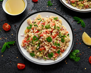 Tabbouleh salad with tomato, cucumber, red onion, bulgur and parsley. Healthy vegan food