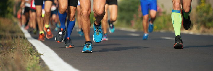 Marathon running race, runners feet on road, sport, fitness and healthy lifestyle concept