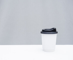 isolate takeaway coffee cup, paper takeout black refreshing drink in blank background. white copy-space on mocha togo mug.