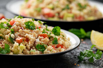 Tabbouleh salad with tomato, cucumber, red onion, bulgur and parsley. Healthy vegan food