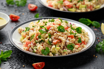 Tabbouleh salad with tomato, cucumber, red onion, bulgur and parsley. Healthy vegan food