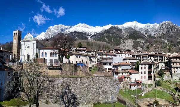 Panorama of the village of Poffabro, one of the most beautiful villages in Italy, with the snowed Mount Raut, in the Friulian Dolomites natural park