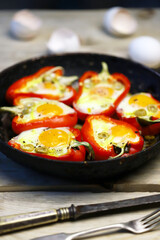 Selective focus. Macro. Baked red peppers with egg in a frying pan. Healthy food. The keto diet.