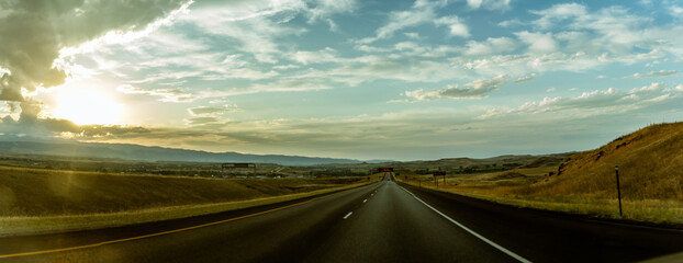 Panorama shot of straight road and getting sunset in america © AllThings