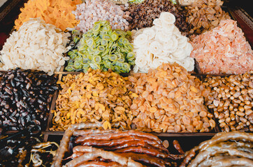 Eastern dried sweets are sold in the market. Dates Dried apricots Plums Kiwi sweets nuts