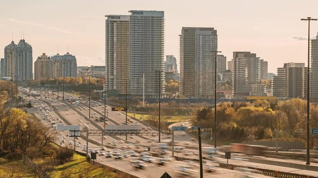 4K Timelapse Sequence of Toronto, Canada - The Ontario 401 Highway at Sunset as seen from a bridge