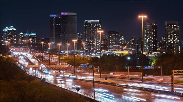 4K Timelapse Sequence of Toronto, Canada - Close up of the Ontario 401 Highway at Night as seen from a bridge