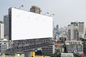 Blank white road billboard with Bangkok cityscape background at day time. Street advertising poster, mock up, 3D rendering. Side view. The concept of marketing communication to promote or sell idea.