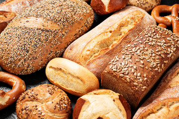 Different fresh baked bread . Food background.