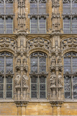 Fototapeta na wymiar Architectural fragments of City Hall (1616) - most popular spot in Ghent. Exterior of Ghent City Hall has many different styles of architecture from Gothic to Renaissance. Ghent, Belgium.