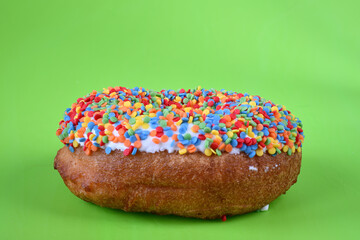 Donut in a multicolored confectionery dressing