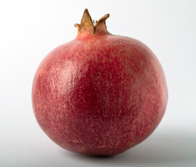 Pomegranate on a white background close-up, selective focus.