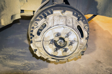 Close-up of a brake drum on the hub of a car.