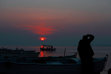 Sightseeing boats at sunset.
