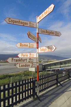 International names of capitals on signposts next to the runway, Kangerlussuaq airport, Greenland, Denmark