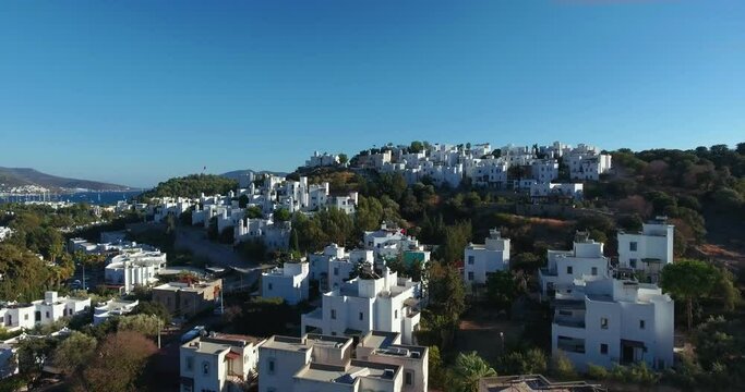 Bodrum,Turkey
Aerial view of white painted houses, trees and sea.4K.