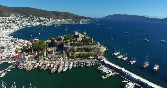 Aerial view of Bodrum marina and Bodrum castle. White painted houses. 4K