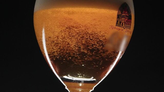 turning glass with Belgian beer