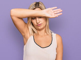 Fototapeta premium Middle age caucasian woman wearing casual clothes covering eyes with arm, looking serious and sad. sightless, hiding and rejection concept