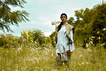 female fashion farmer in the middle of the forest