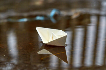 Photo of paper boat in water