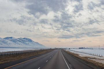 Fototapeta na wymiar Winter snow highway among mountains. Utah, USA, 12-12-2019
