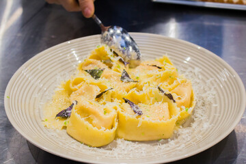 the chef prepares tarteloni