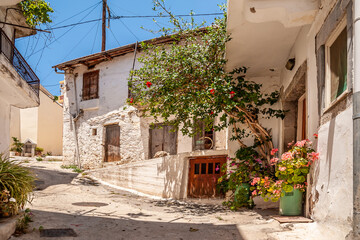 Fototapeta na wymiar Old courtyard with stone facades of houses