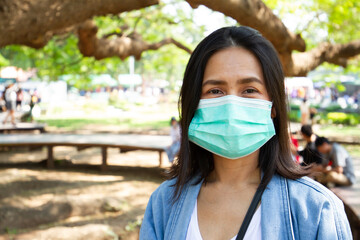 Virus mask Asian woman travel wearing face protection in prevention for coronavirus in Thailand.