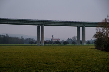 Town with Church under the Bridge from a Autobahn in Germany.