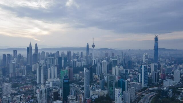 4K UHD ProRes Aerial Hyperlapse cinematic of Kuala Lumpur city view during dawn overlooking the city skyline in Federal Territory, Malaysia