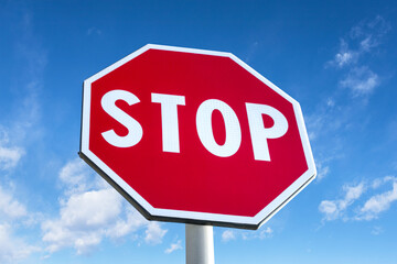 Stop traffic sign with clear blue sky