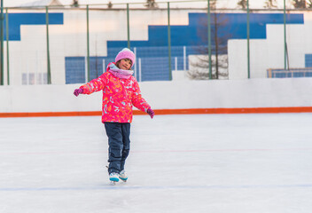 Little happy girl skating